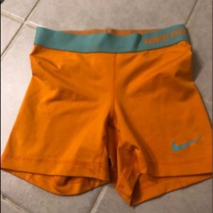 Orange Nike pros